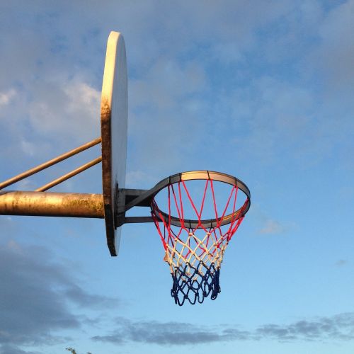 basketball hoop evening sky dusk