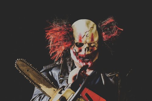 horror clown  mass murderer  chainsaw