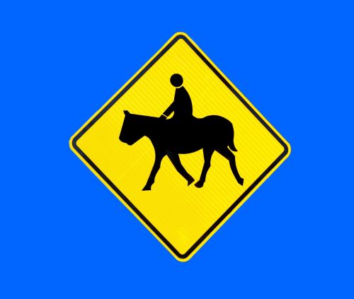 horse crossing sign horse rider