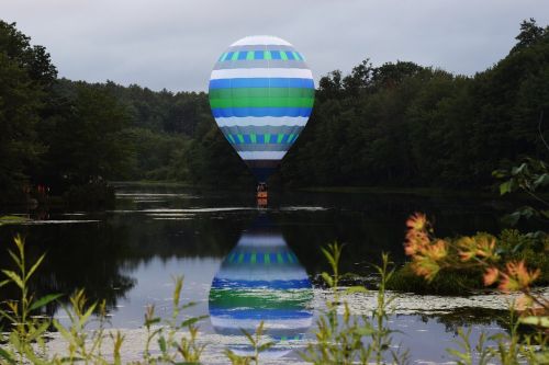 hot air balloon blue water