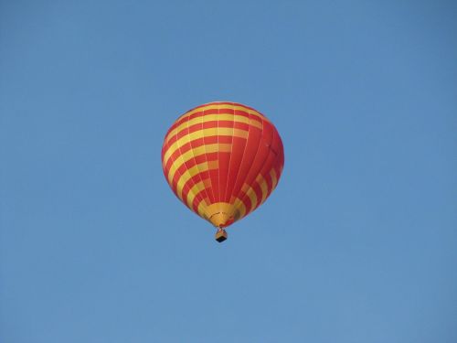 hot air balloon partly cloudy sky