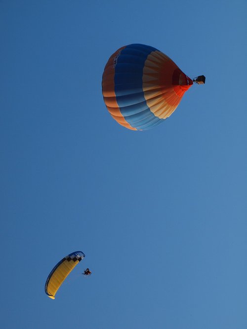 hot air balloon  paragliding  blue
