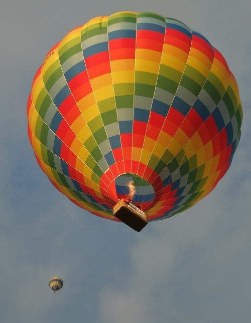 hot air balloon rising sky