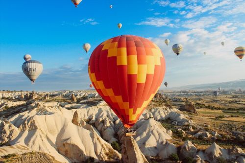 hot air balloons rocks cliffs