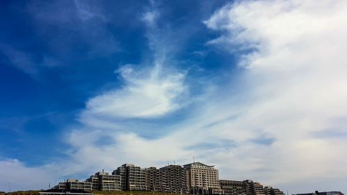 hotel complex clouds sky