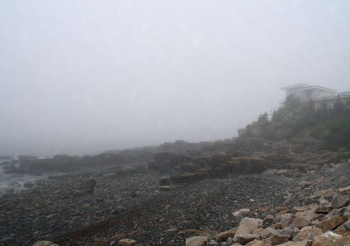 House In Fog Along Ocean