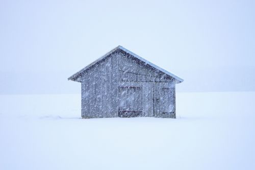 hut blizzard snowflakes