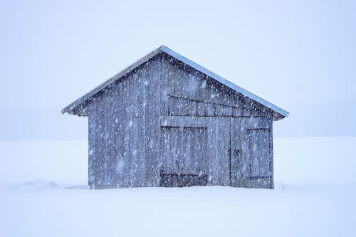 hut blizzard snowflakes
