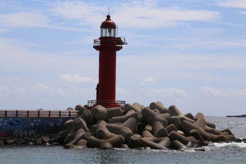 jeju island red lighthouse blue sky