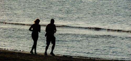 jogging couple beach
