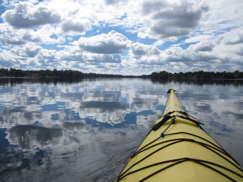 kayak clouds reflection