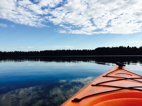 kayak water clouds