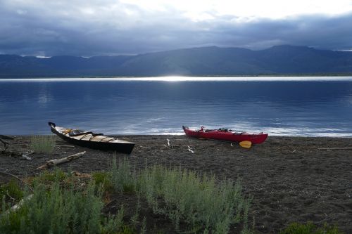 kayaks beached lake