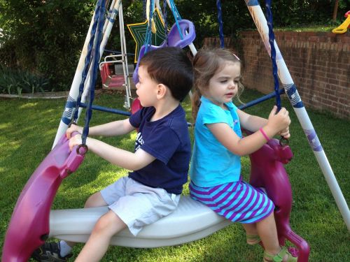kids at swing daycare playground