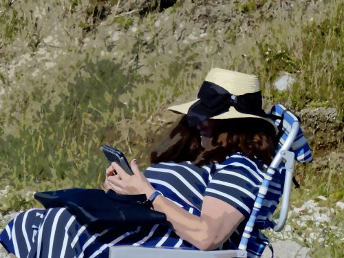 Lady Reading At Beach