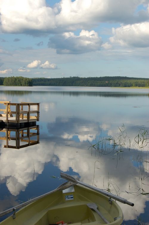lake lake in finland cumulus clouds