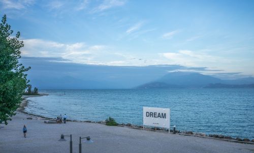 lake garda beach mountains