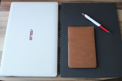 laptop pen notebook