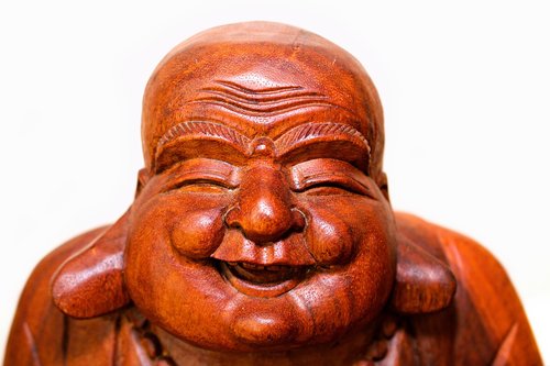 laughing buddha head  wooden  smile
