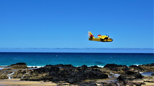 light aircraft  propeller plane  ocean