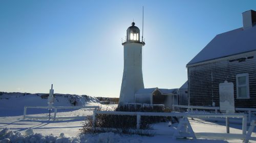 light house snow sun