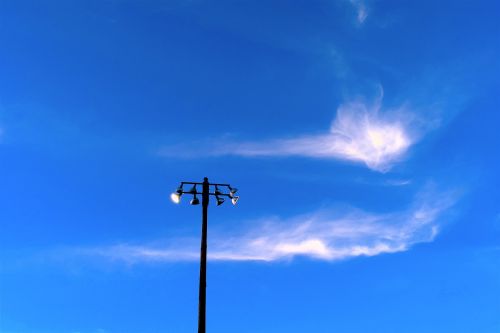 light pole sky clouds