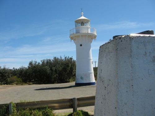 lighthouse white blue sky