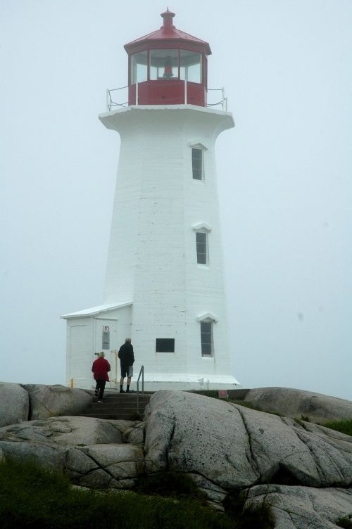 lighthouse fog rocks