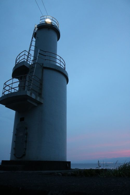 lighthouse sea sunset