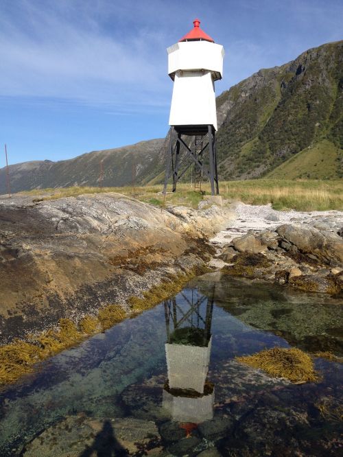 lighthouse reflection sea