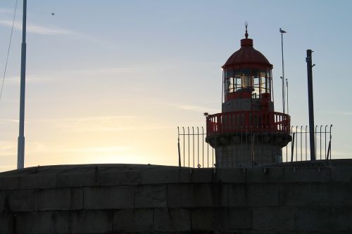 lighthouse sunset sea