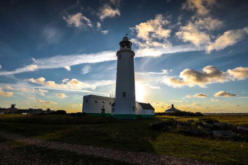 lighthouse sunset coast