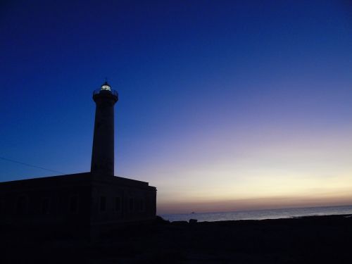 lighthouse dawn sun