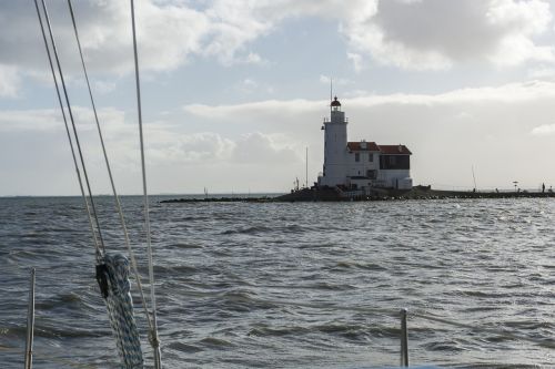 lighthouse marks boat