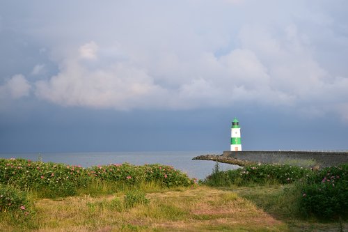 lighthouse  approximately  clouds