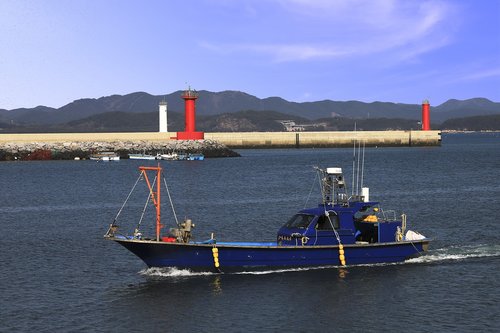 lighthouse  fishing boats  sea