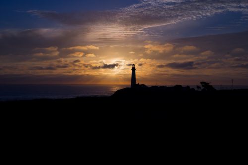 lighthouse silhouette sunset