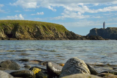 Lighthouse And Rocks