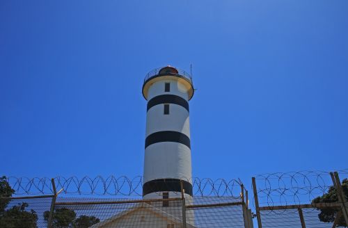 Lighthouse Behind Fence