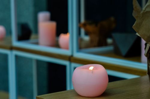 lighting candle pink