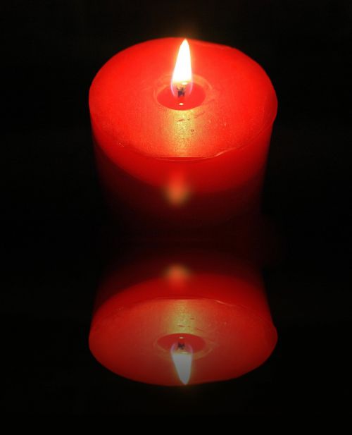 Lit Candle Reflection