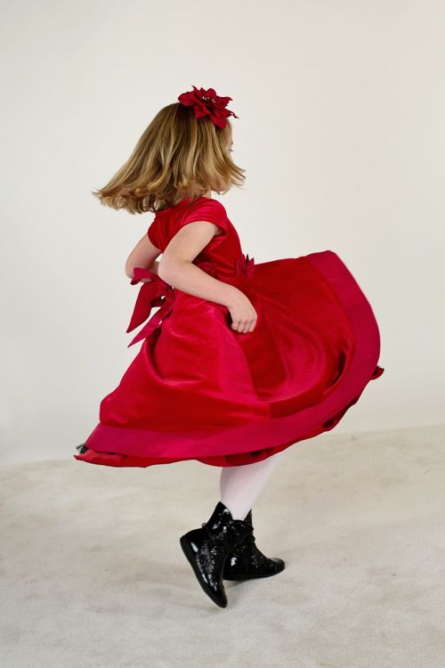 little girl running red dress