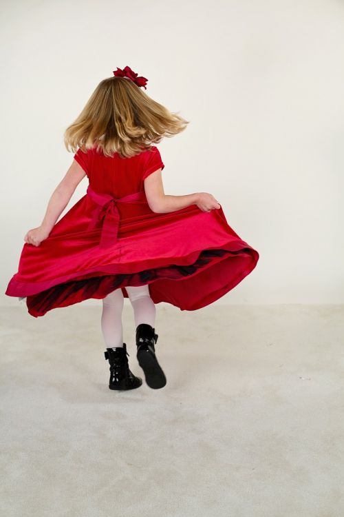 little girl running red dress