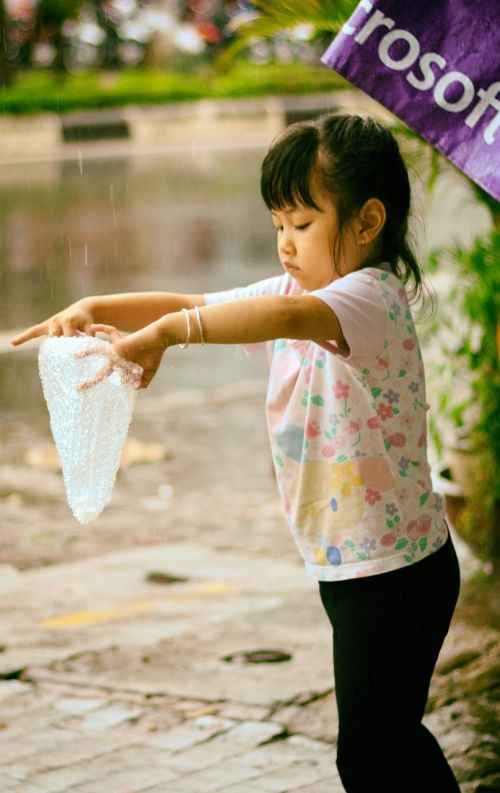 little girl kid rain