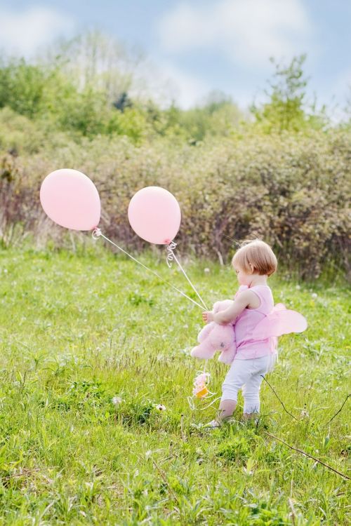 little girl with balloons summer happiness