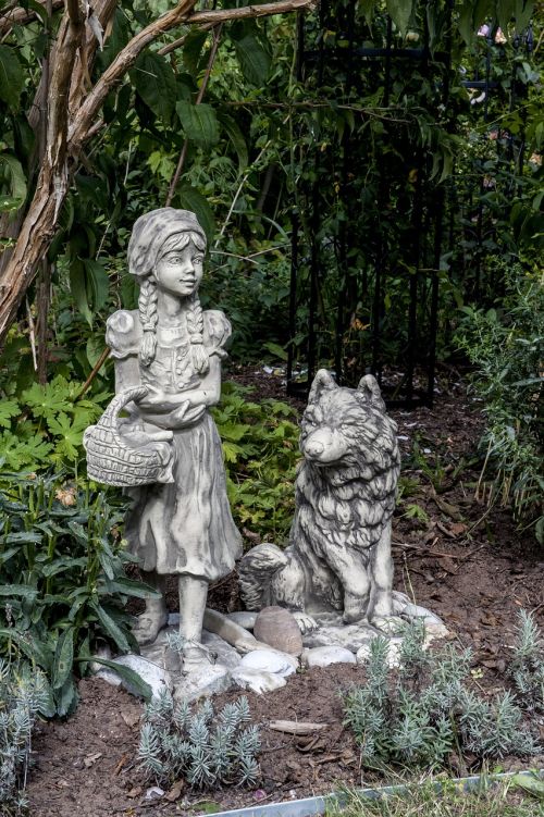 little red riding hood and wolf stone sculpture