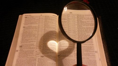 book reading magnifying glass