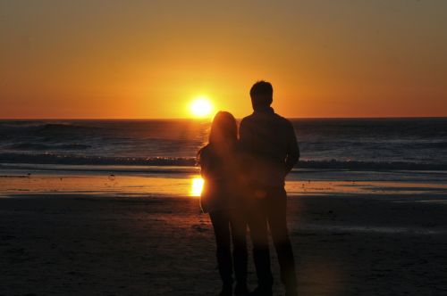 Lovers Enjoying Ocean Sunset