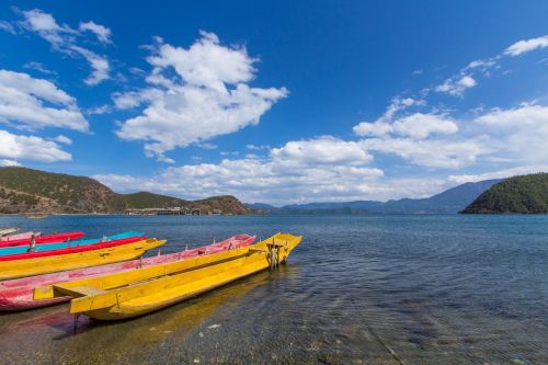 lugu lake lake wooden boat