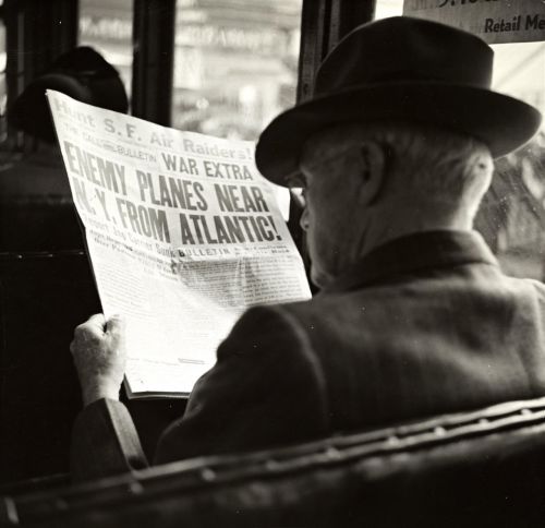 man newspaper hat